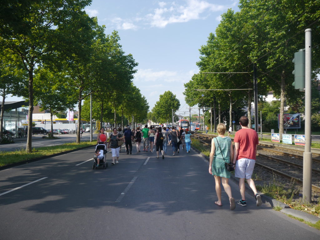 People walking on the blocked street