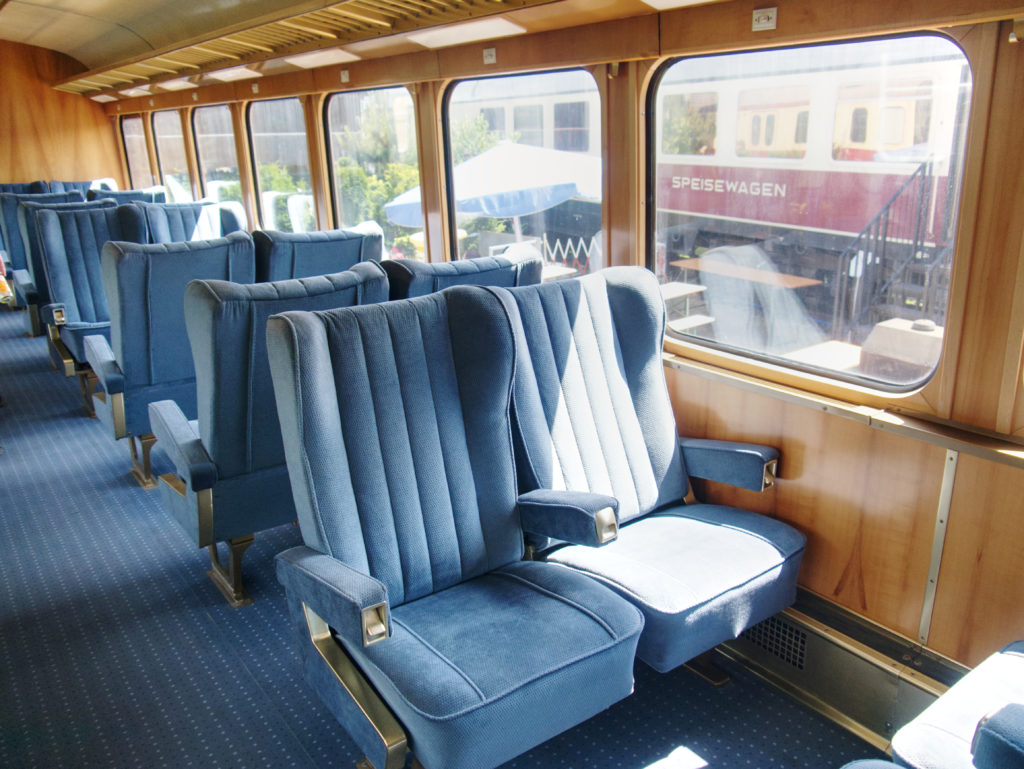 Inside an old train, seats